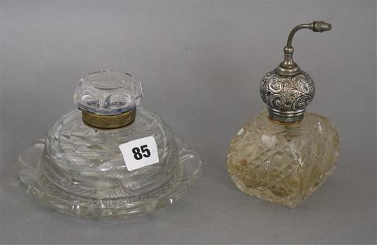 A silver mounted cut glass atomiser and a glass inkwell